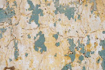 Old dirty wall with peeling paint