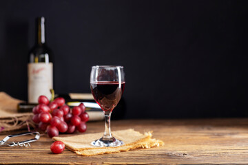 Red grape juice in a glass placed on a wooden table or red wine, a delicious natural healthy juice...