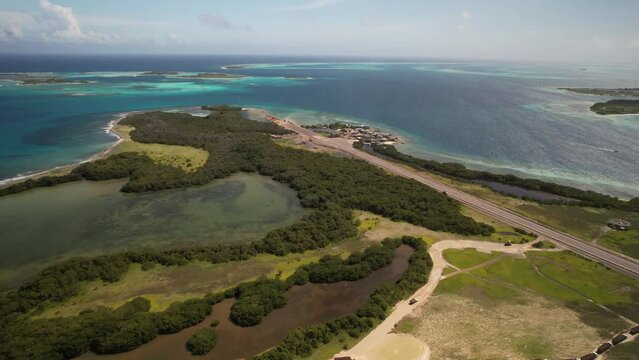 Los roques archipelago showing the contrast of lush greenery and turquoise waters, aerial view