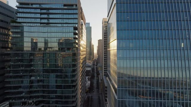 Aerial of downtown city street with skyscrapers and tall buildings