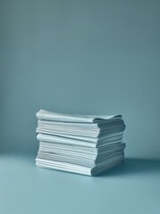 newspaper stacked on blue background