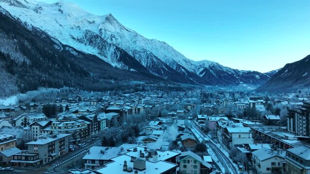 Aerial Drone pan of Chamonix ski valley in the french alps mountians on a cold winter morning