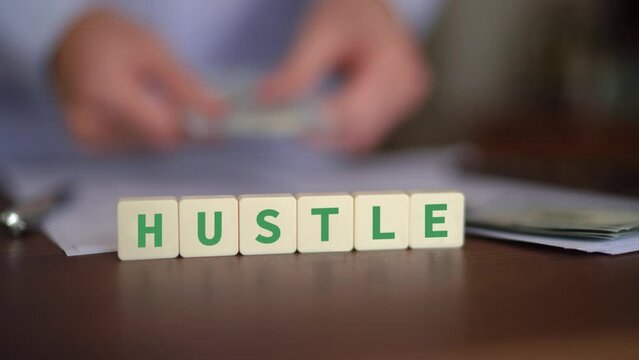 Concept of side hustle and making money. Selective focus with cash on the background.