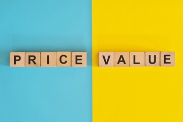 Price versus value in business and consumerism concept. Wooden blocks typography in bright blue and...