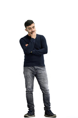 Naklejka premium A man, full-length, on a white background, thinks
