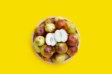 Fresh jujube fruit on yellow background