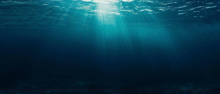underwater front view of blue water ocean with natural sun light