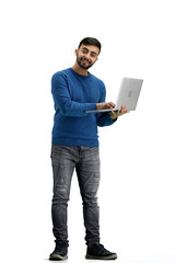 A man, full-length, on a white background, uses a laptop