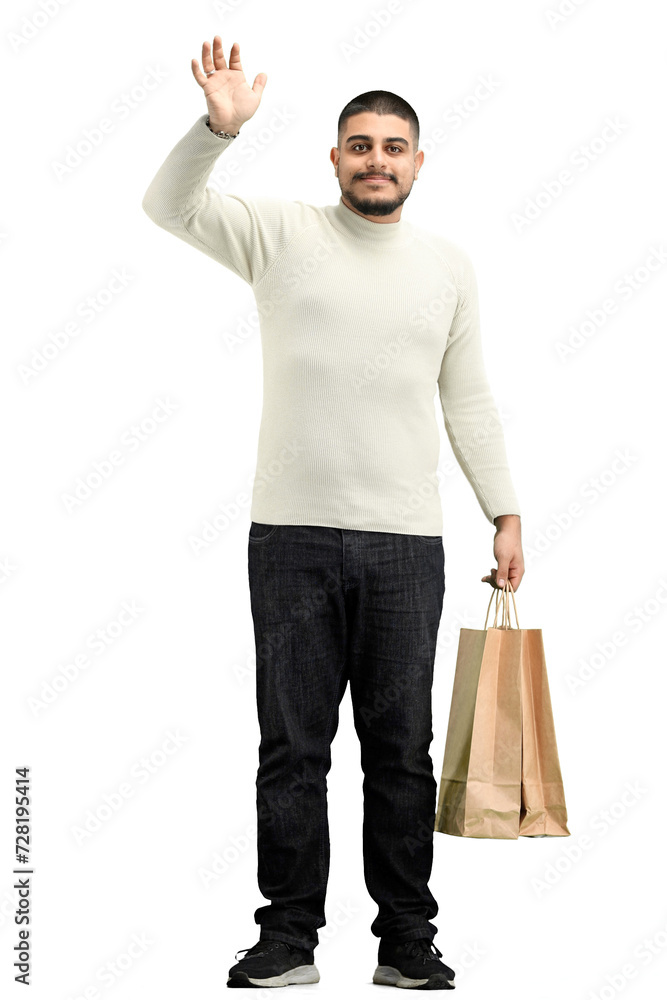 Canvas Prints A man, full-length, on a white background, with bags, waving his hand