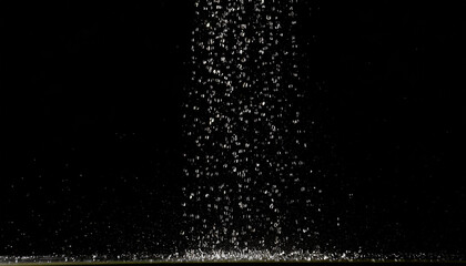 Obraz premium Falling drops, rain, bouncing, water, black background