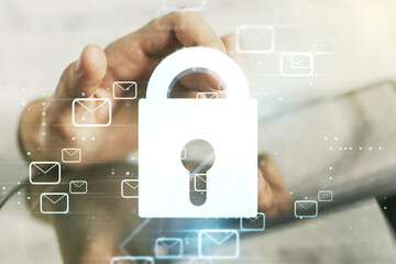 Creative concept with lock symbol and postal envelopes illustration and with finger clicks on a digital tablet on background. Protection and firewall concept. Multiexposure