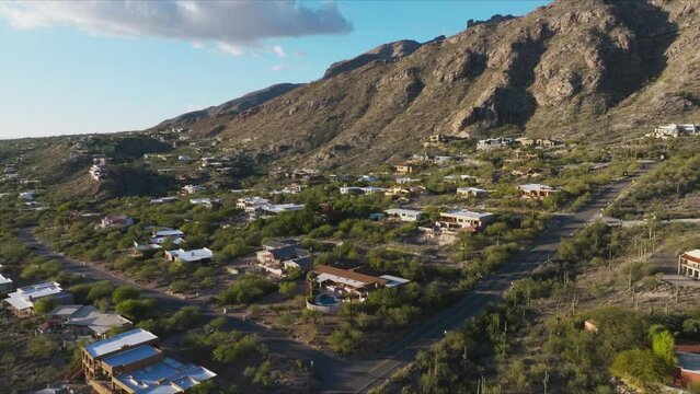 Flying Over Catalina Foothills in Tucson Arizona Under Bright Blue Sky, Elegant Homes in Hills