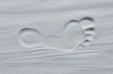 Footprint of human feet on the white sand - 728207207