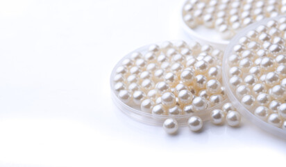Pile of pearls on the white background