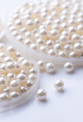 Pile of pearls on the white background - 728207213
