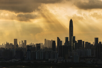 Fototapeta na wymiar Silhouette of skyline of Shenzhen city, China under sunset. Viewed from Hong Kong border