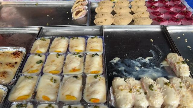 Closeup shot of white Rasmalais in a sweet shop in Kolkata, India.