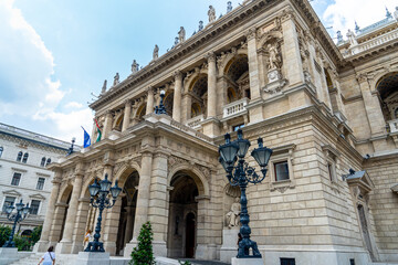 Fototapeta na wymiar The Budapest State Opera House along Andrassy street is a magnificent work of architectural elegance and artistic heritage, Renaissance and Baroque art. Hungary 