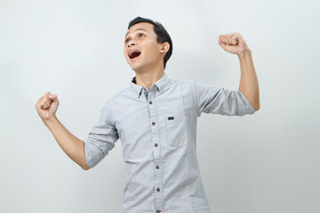 happy confident asian indonesian man on isolated background