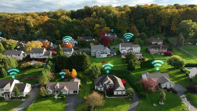 Suburban USA homes with animated Wi-Fi symbols. Aerial truck in America neighborhood during autumn. Remote hybrid employees at houses. Wifi internet speeds with fiber optic. Futuristic network.