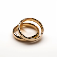 Two intertwined gold wedding bands on a white background, symbolizing unity and marriage commitment