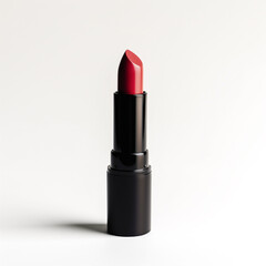 Fototapeta premium Red lipstick twisted up from a black tube against a plain white background, highlighting beauty and cosmetics