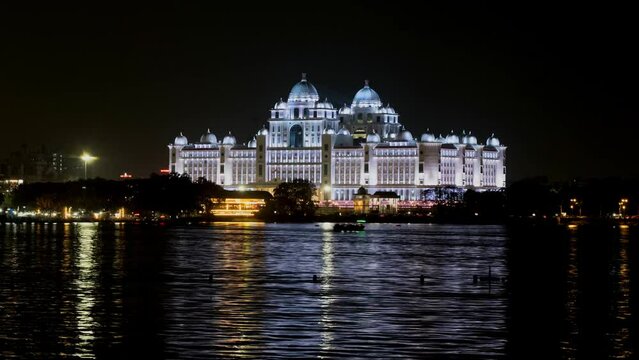 telangana Secretariat building with boats in hussain sagar lake at night push in timelapse 4k, at hyderabad, telangana, india