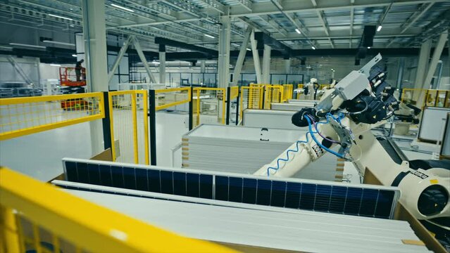 Automatic Solar Panel Manufacturing Line. Automated equipment inside the modern robotic manufacturing. Innovative factory indoors. 4k