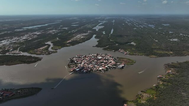 Aerial overview of boats and the Mexcaltitan village, in sunny Nayarit, Mexico