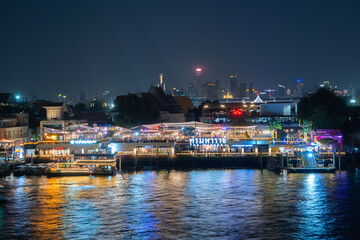 Aerial view of Bangkok Downtown Skyline with Chao Phraya River, Thailand. Financial district and business centers in smart urban city in Asia. Skyscraper and high-rise buildings.