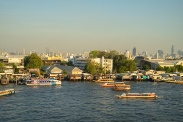 Fototapeta premium Aerial view of Bangkok Downtown Skyline with Chao Phraya River, Thailand. Financial district and business centers in smart urban city in Asia. Skyscraper and high-rise buildings.