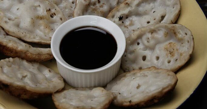 Fluffy ground rice powder pancake Bengali chitoi Dhaka  Chikui  Sora pitha serviced with liquid molasses on rustic wood table background