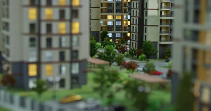 Panorama of miniature model of apartment buildings with landscape and roads