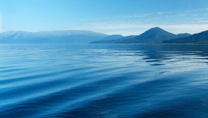 Calm waves of the sea under a blue sky. 