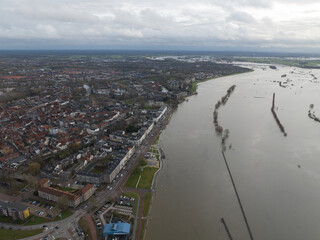 Aerial overview of the city of Zutphen, along the river Ijssel in Gelderland, The Netherlands. Birds eye aerial drone view in the Dutch province of Gelderland.