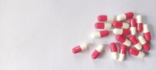 Medicine pills capsules on white background