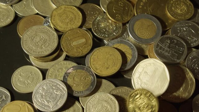 Close up view: Coins of different nations and denominations on table