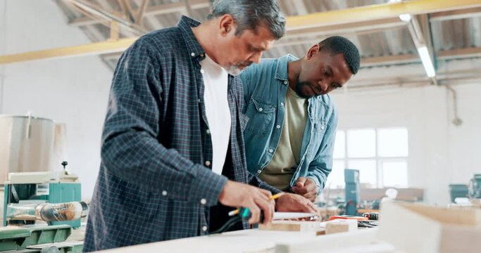 Engineering, teamwork or carpenter in workshop to measure for manufacturing, woodwork or furniture. Tape, production tools or industrial workers in warehouse working for building project or craft