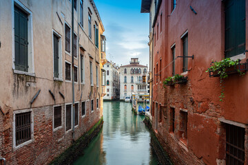 Fototapeta na wymiar Cityscape and canals of Venice and colorful and old architecture of the city