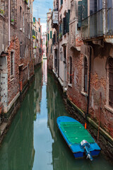 Fototapeta na wymiar Cityscape and canals of Venice and colorful and old architecture of the city