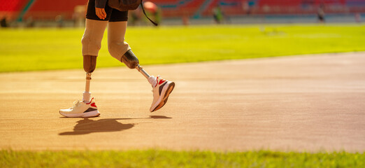 Paralympic runner wearing prosthetic leg on track and field Walk and get ready