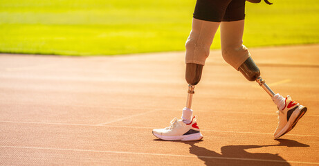 Paralympic runner wearing prosthetic leg on track and field Walk and get ready