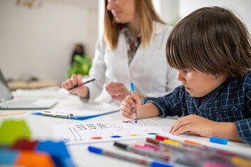 Preschool boy solving a cognitive assessment test