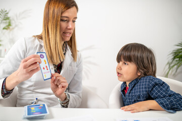 Growth of early mental acuity as a toddler engages in a captivating logic test with numbered cards,...