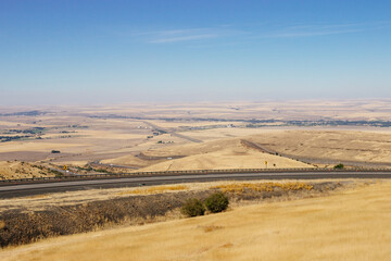 Beautiful summer landscape with a bird's eye view of the hills and mountains in Oregon, USA, on a sunny day.