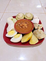 Siomay is a typical Indonesian food made from cabbage, potatoes, eggs, bitter melon and tofu boiled in peanut sauce
