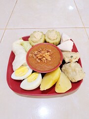 Siomay is a typical Indonesian food made from cabbage, potatoes, eggs, bitter melon and tofu boiled in peanut sauce
