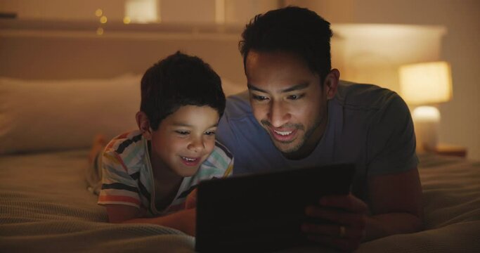 Night, bedroom and father with boy, tablet and typing with online story and bonding together. Family, dad and kid with technology or home with fun and child development with toddler or playing a game