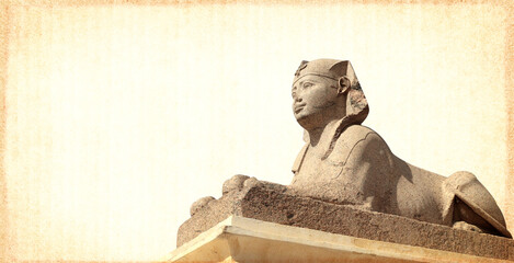 Grunge background with paper texture and  sphinx statue. Horizontal banner with ancient egyptian...