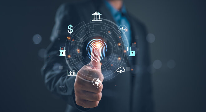 Man using thumb to scan finger print or for digital processing biometric identification to access security system includes internet banking, cloud system and mobile phone , Cyber security concept.